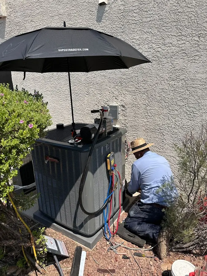 HVAC technician performing outdoor AC maintenance in Yorkshire